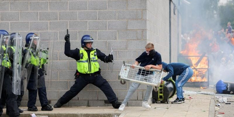 angry protester clashing with police in uk photo reuters