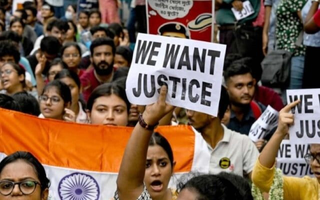 junior doctors carry india s national flag and hold placards during a protest to demand justice over the rape and murder of a doctor in early august in kolkata on monday photo afp