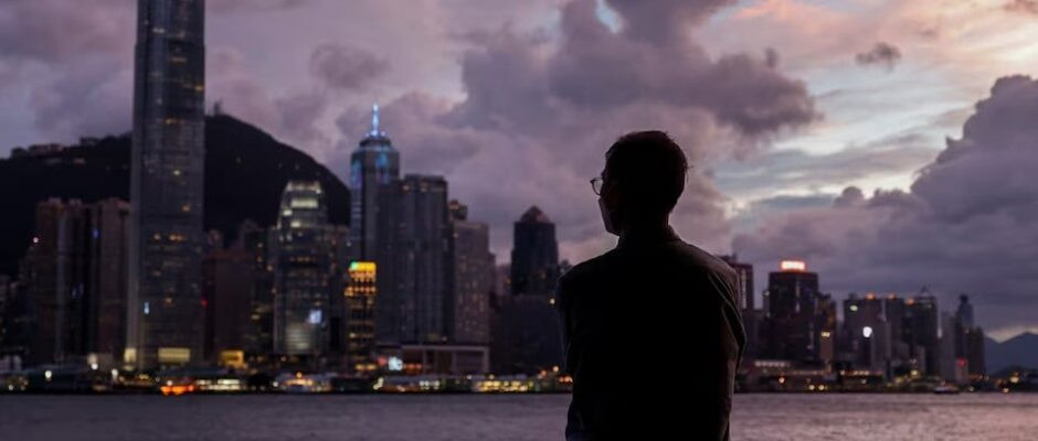 a man stands in front of victoria harbour with the central financial district in the background as typhoon yagi approaches in hong kong china on september 5 2024 photo reuters